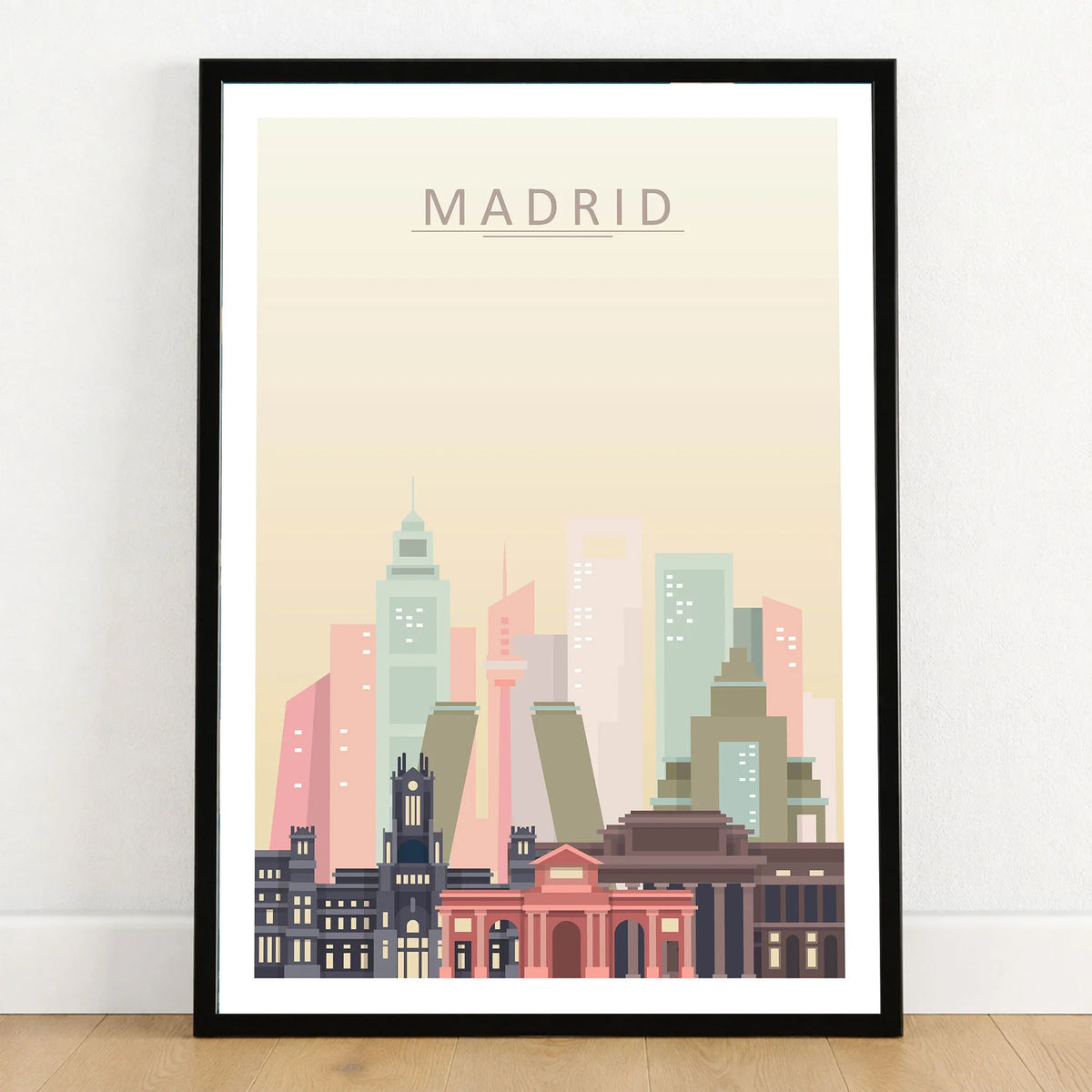 Madrid city skyline art print in a black frame on a wooden floor