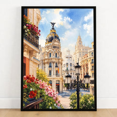 Madrid Metropolis building on Gran Vía watercolour art print in a black frame on a wooden floor