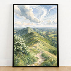 Malvern Hills ridge path watercolour art print in a black frame on a wooden floor