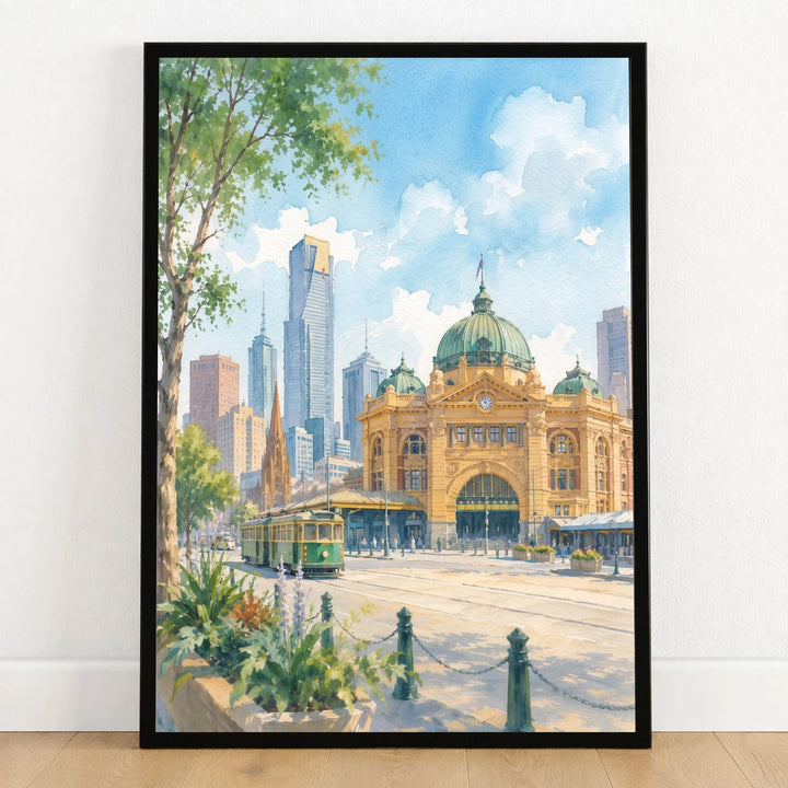 Melbourne Flinders Street Station and tram watercolour art print in a black frame on a wooden floor