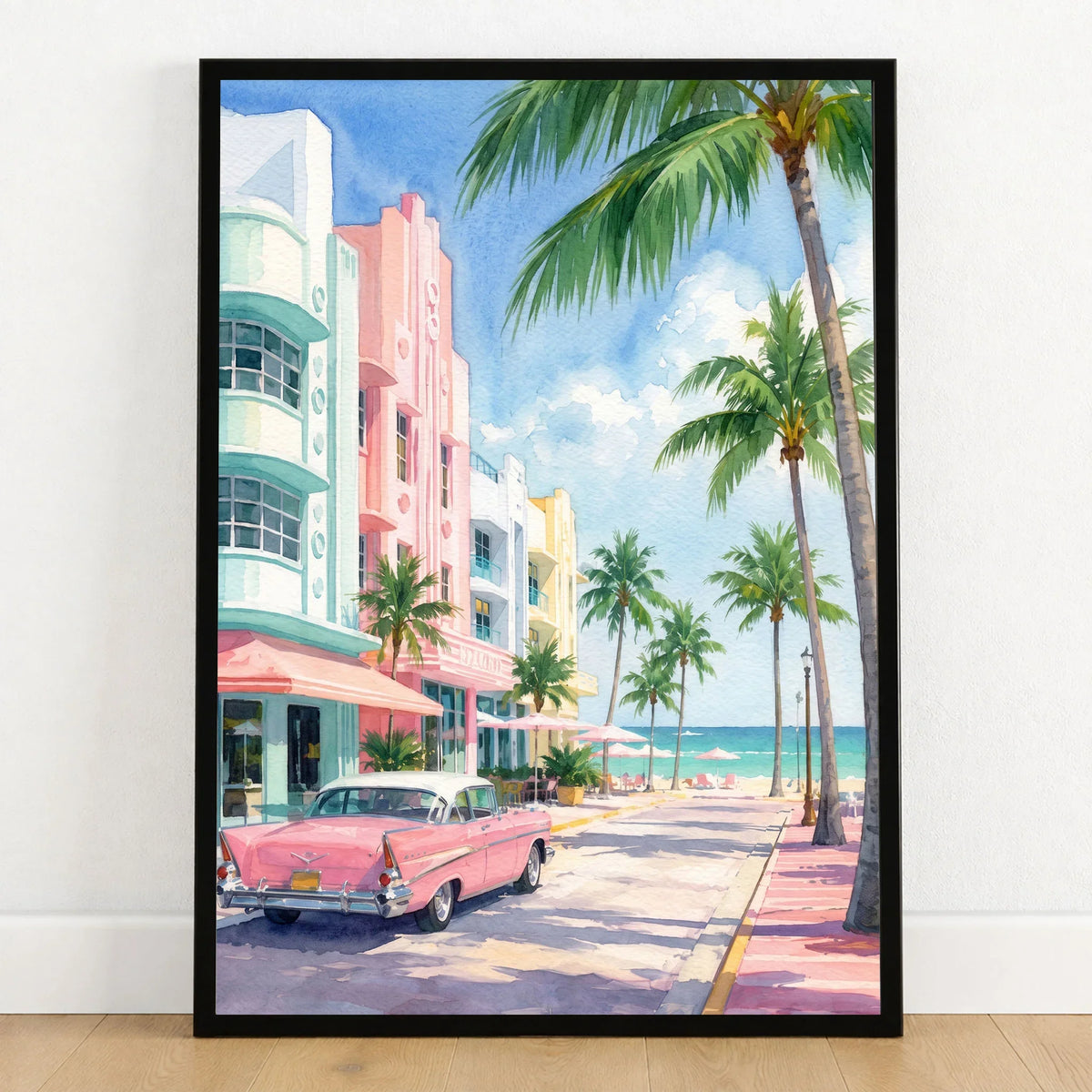 Miami Art Deco Ocean Drive and classic car watercolour art print in a black frame on a wooden floor