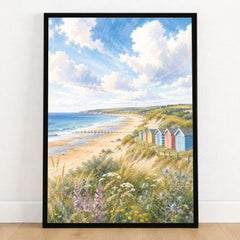 Norfolk Coast beach huts and sandy beach watercolour art print in a black frame on a wooden floor