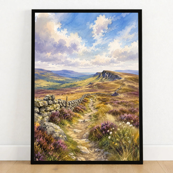 North Pennines moorland path and stone wall watercolour art print in a black frame on a wooden floor