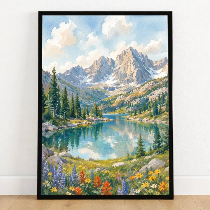 Rocky Mountain National Park alpine lake below rugged peaks watercolour art print in a black frame on a wooden floor