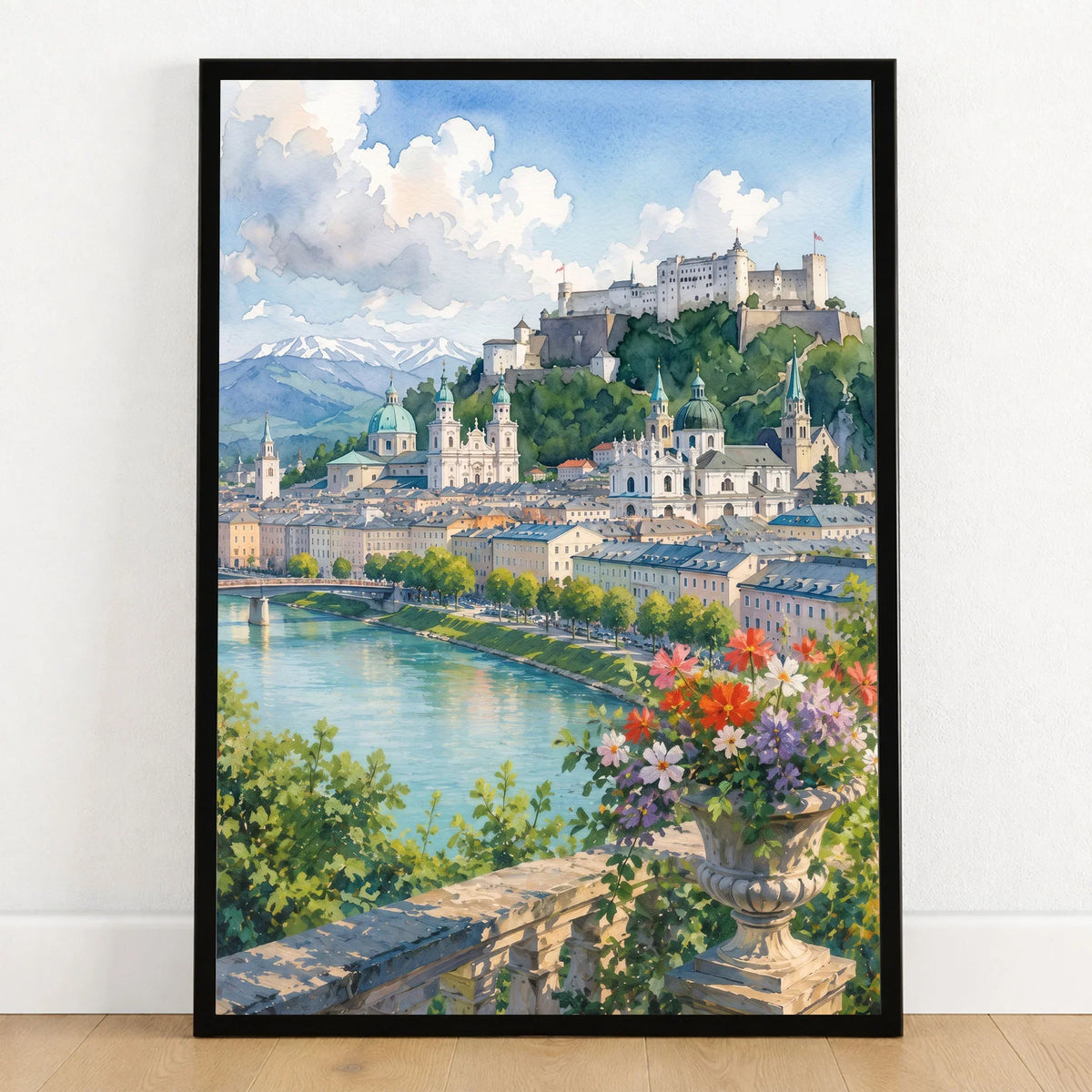 Salzburg Hohensalzburg fortress and old town watercolour art print in a black frame on a wooden floor