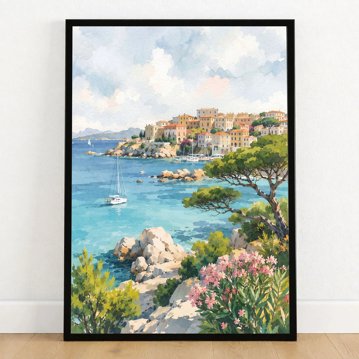 Sardinia turquoise coves and harbour town watercolour art print in a black frame on a wooden floor