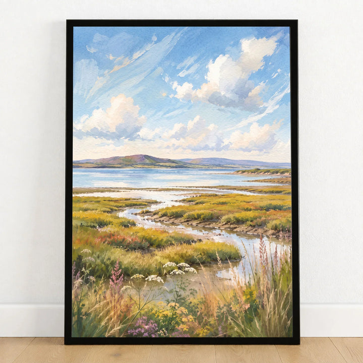 Solway Coast salt marsh estuary watercolour art print in a black frame on a wooden floor