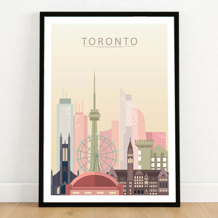 Toronto city skyline art print in a black frame on a wooden floor