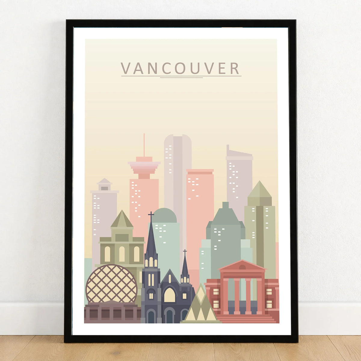 Vancouver city skyline art print in a black frame on a wooden floor