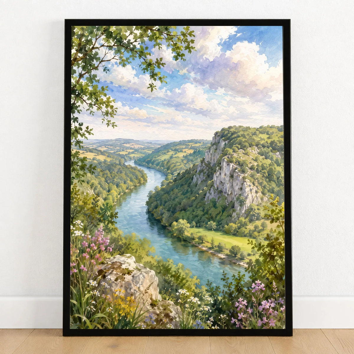 Wye Valley river and limestone cliffs watercolour art print in a black frame on a wooden floor