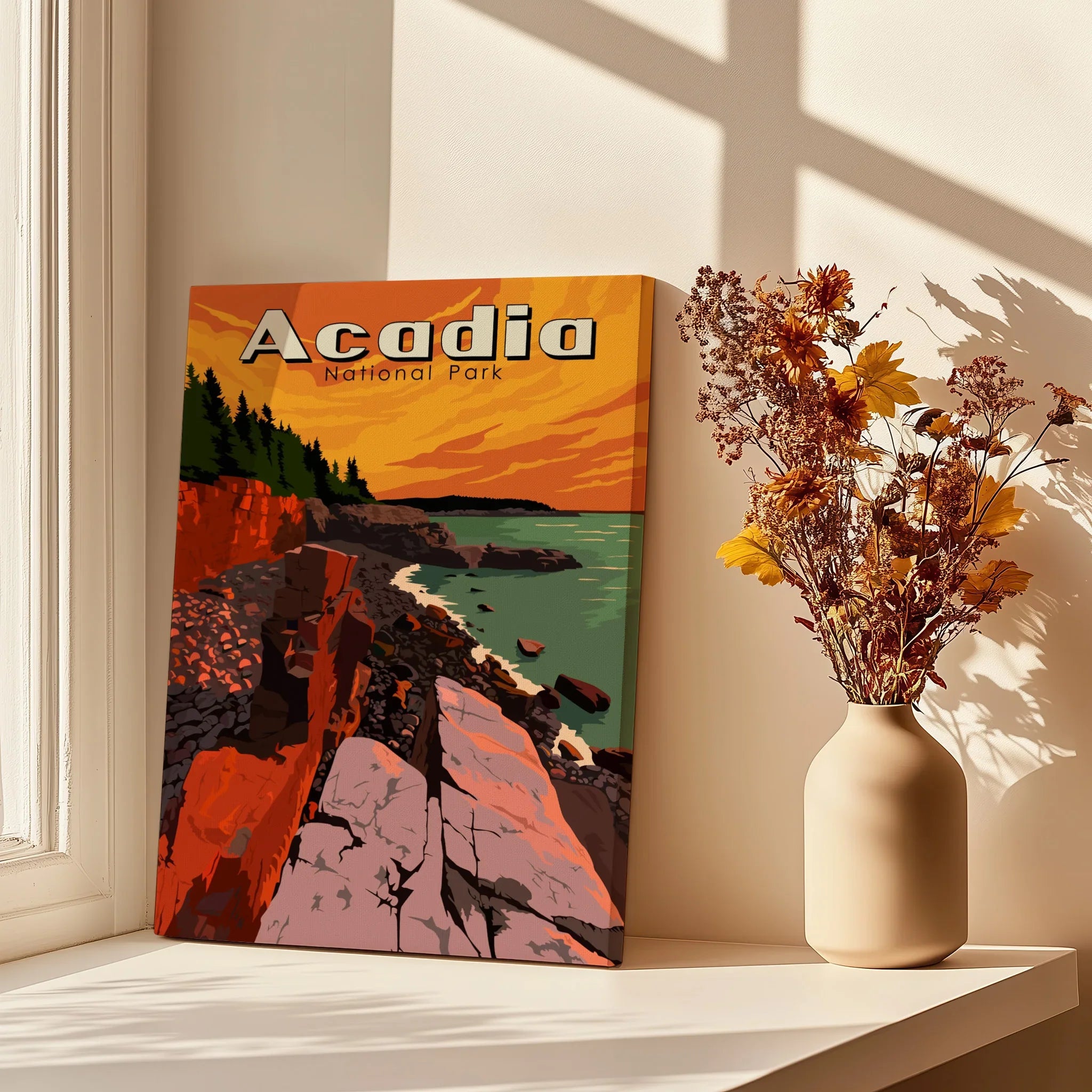 Acadia National Park canvas print with sunset coastline, beside vase of dried flowers on windowsill