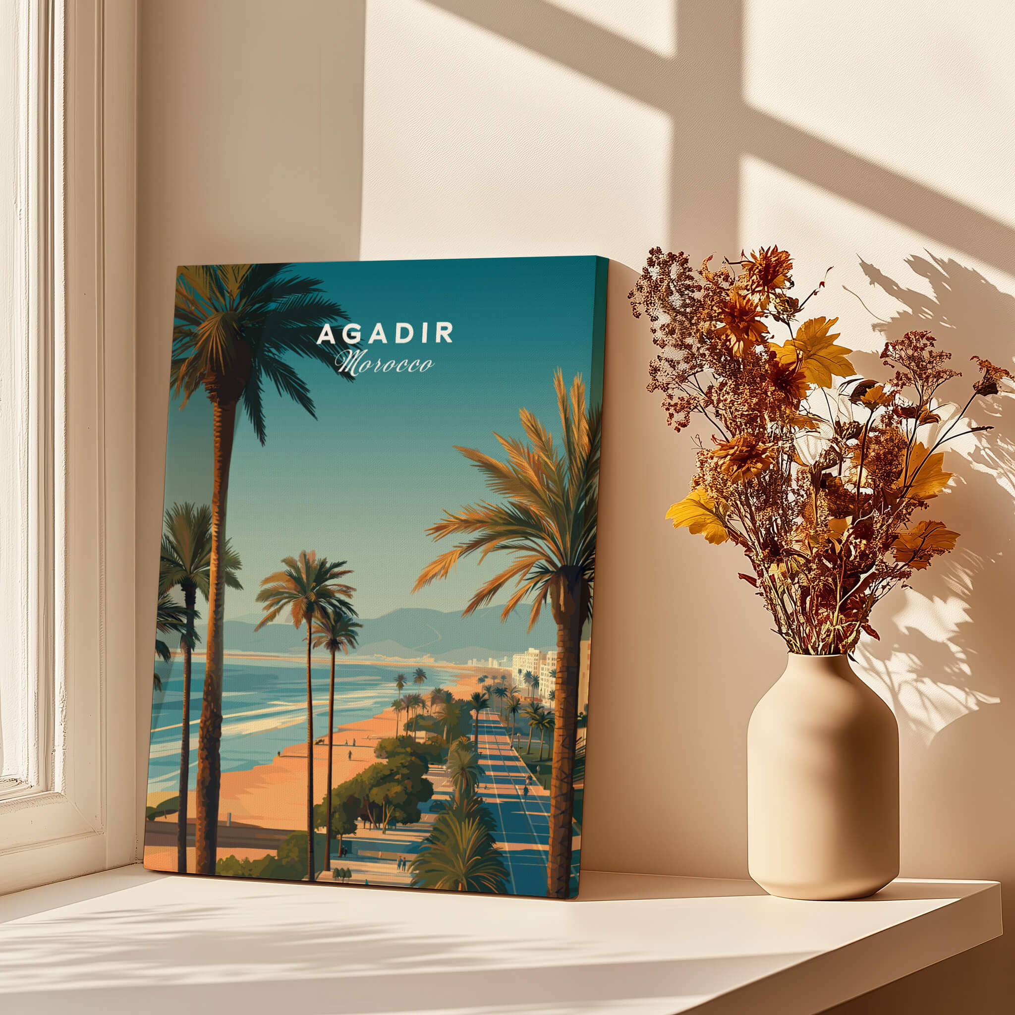 Agadir Travel Poster Print Morocco - Palm Trees displayed by a window with a vase of dried flowers.