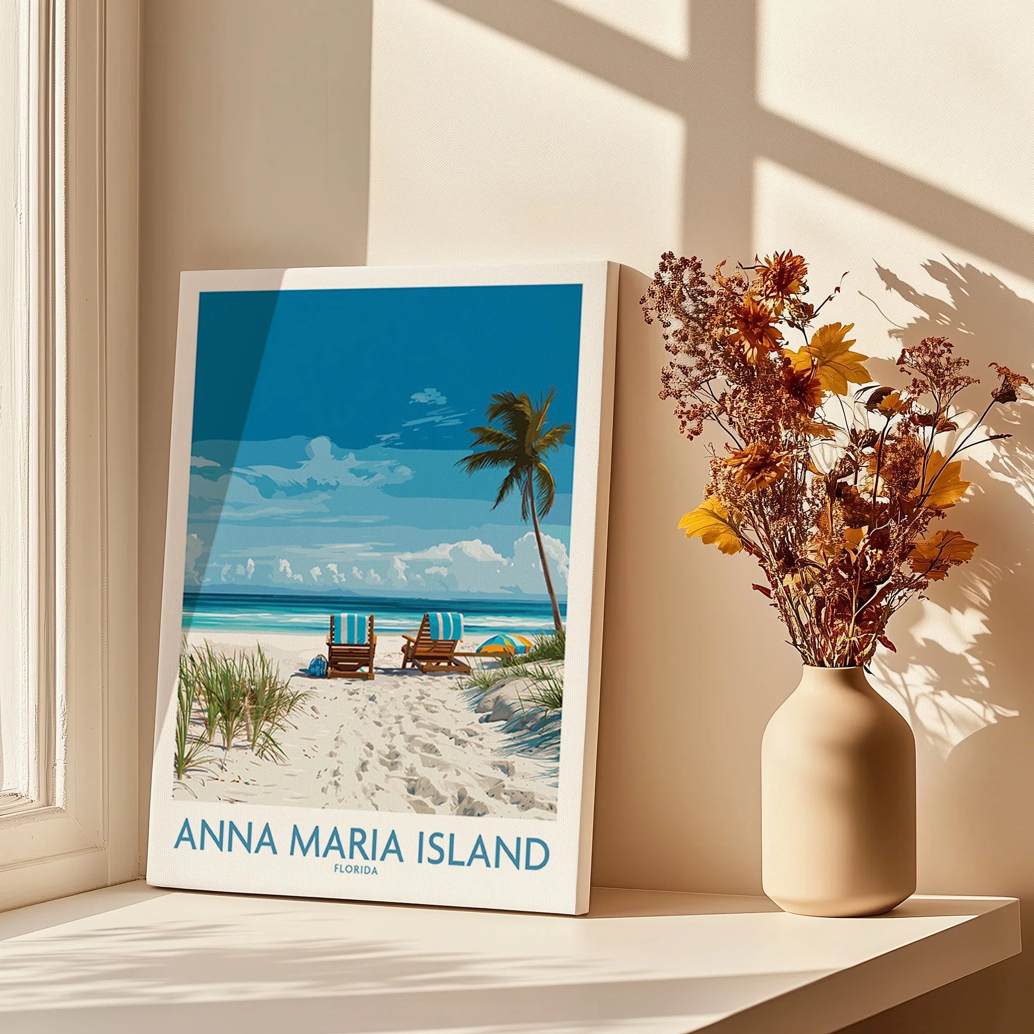 Anna Maria Island travel poster with beach scene on canvas, displayed by window and vase with dried flowers