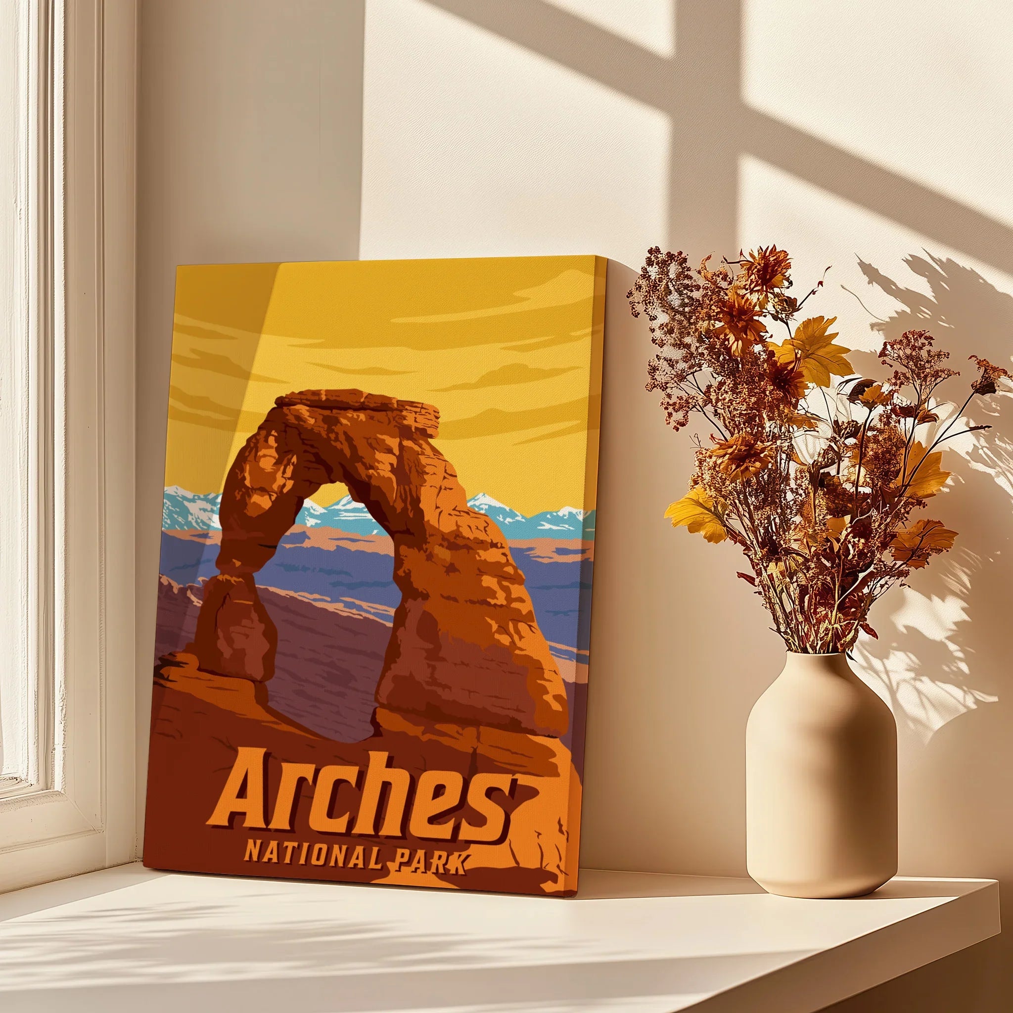 Arches National Park canvas print with Delicate Arch, vase of dried flowers, sunlit window.