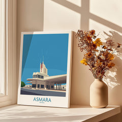Asmara Eritrea Print – Fiat Tagliero Poster displayed near flowers in a vase, showcasing Art Deco architecture.