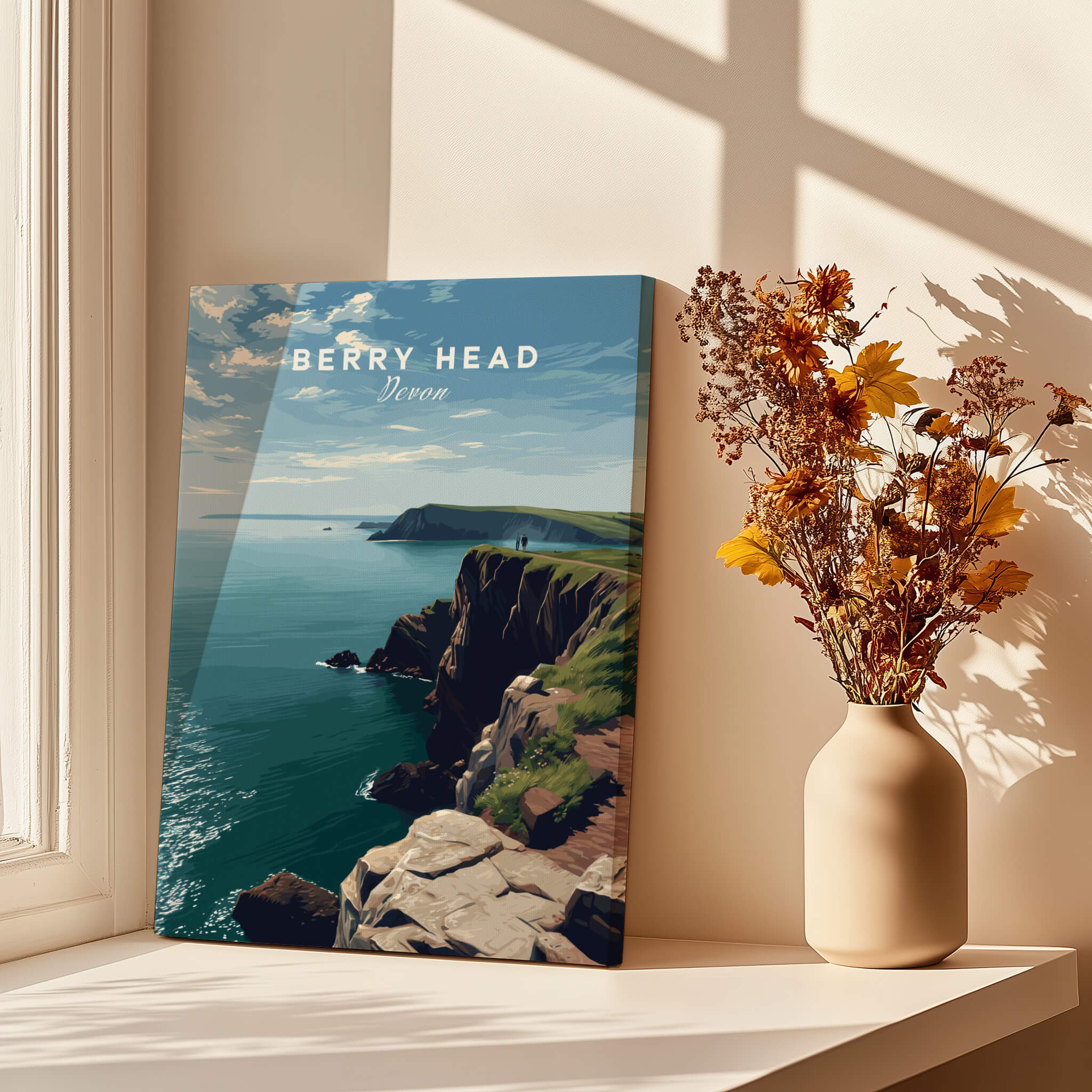 Berry Head Travel Poster – Devon Coastal Cliffs and Ocean View Print displayed by a window with floral arrangement.