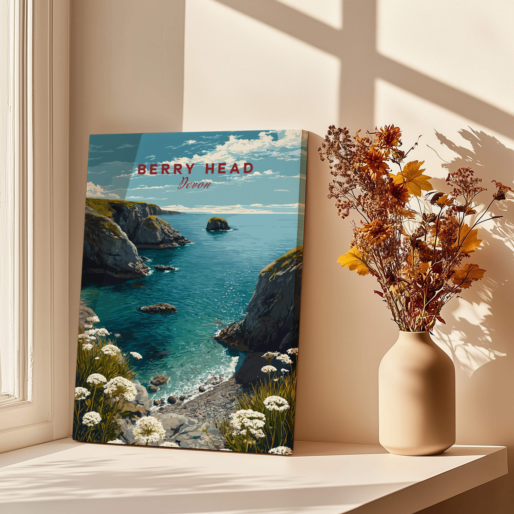Berry Head Travel Poster – South Devon Coastline and Wildflower Art displayed by a window with flowers.