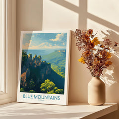 Blue Mountains travel poster print near window with dried flowers in vase, wall art decor