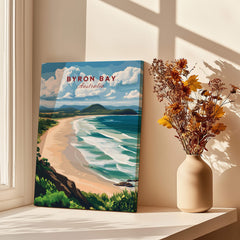 Byron Bay Beach Print - Australia Wall Art displayed next to a vase in a sunlit interior.