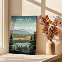 Cairngorms National Park art print on windowsill with vase of dried flowers in sunlight