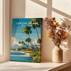 Captiva Island Travel Poster – Florida Beach Houses and Palm Trees Art displayed in a sunlit room with a vase of flowers.