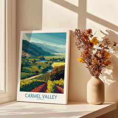 Carmel Valley California travel poster canvas print on windowsill with vase of autumn flowers
