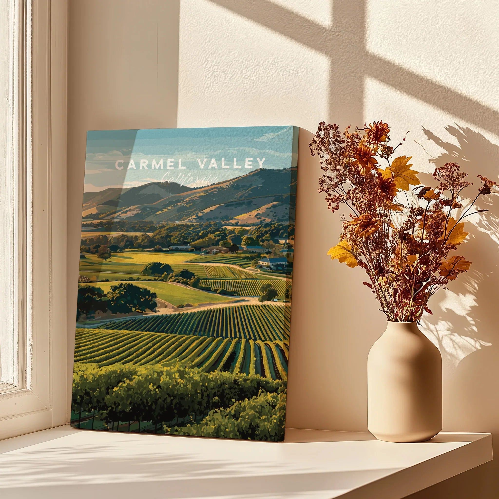 Carmel Valley California travel poster print on windowsill with shadows and dried flowers