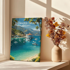 Catalina Island travel poster print by a sunlit window with vase of dried flowers