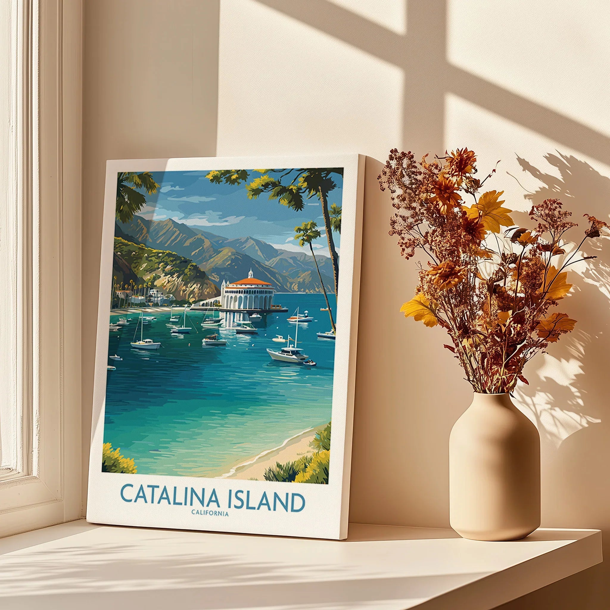 Catalina Island travel poster canvas on windowsill with vase of dried flowers in sunlight