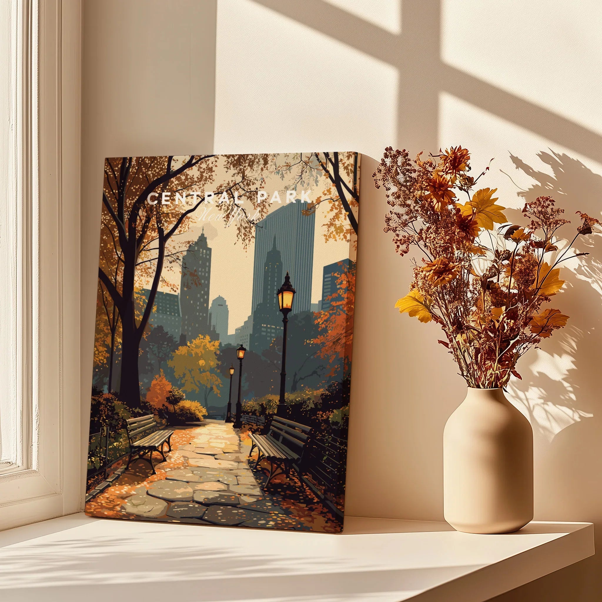 Central Park canvas print with autumn cityscape on a windowsill, next to vase of dried flowers