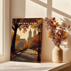 Central Park canvas print with autumn trees and city skyline, styled next to flowers on a windowsill