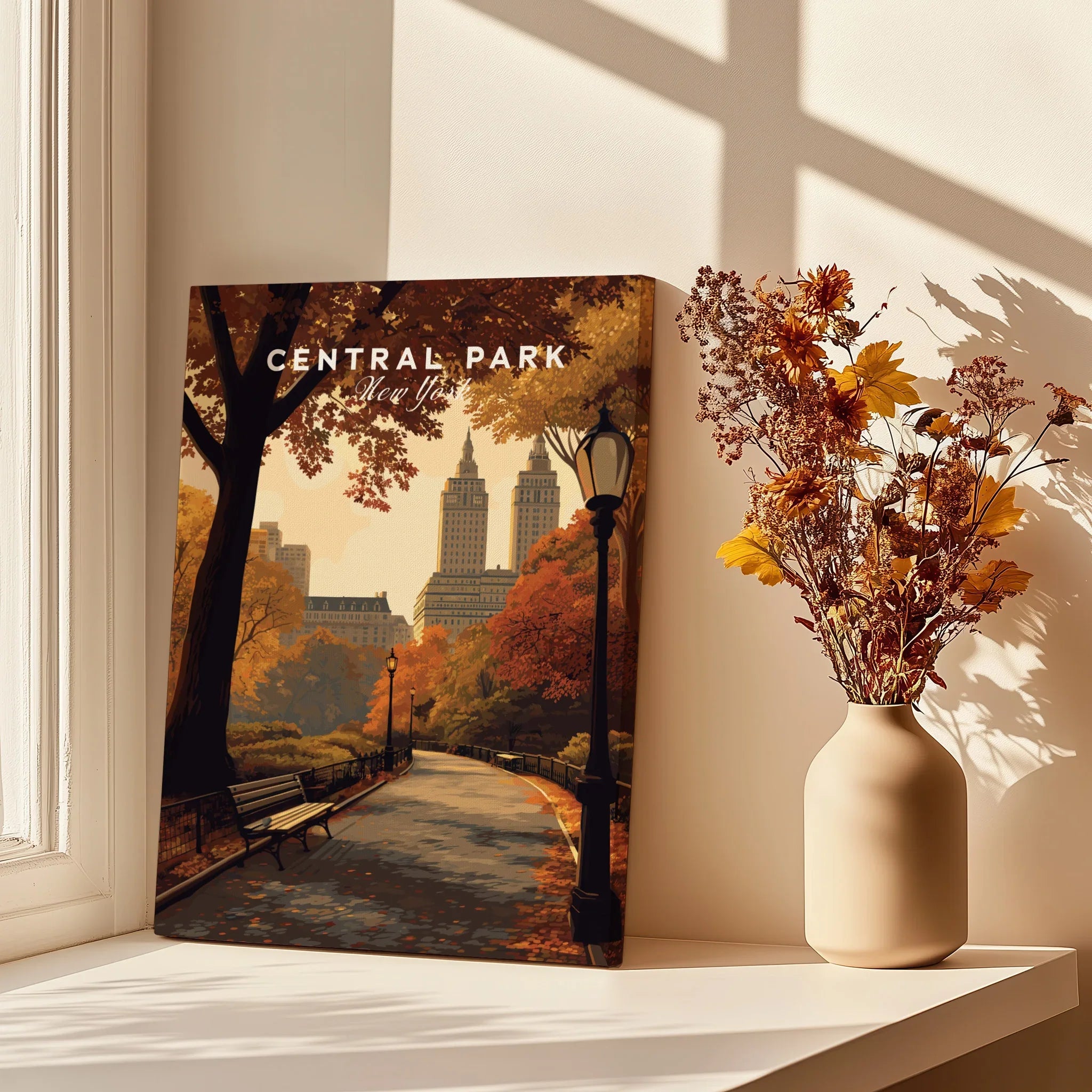 Central Park canvas print with autumn trees and city skyline, styled next to flowers on a windowsill