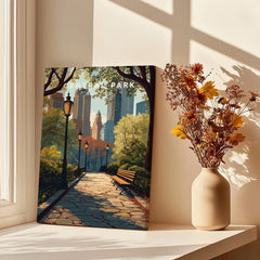 Central Park canvas art print with city skyline, on sunlit windowsill next to dried flowers