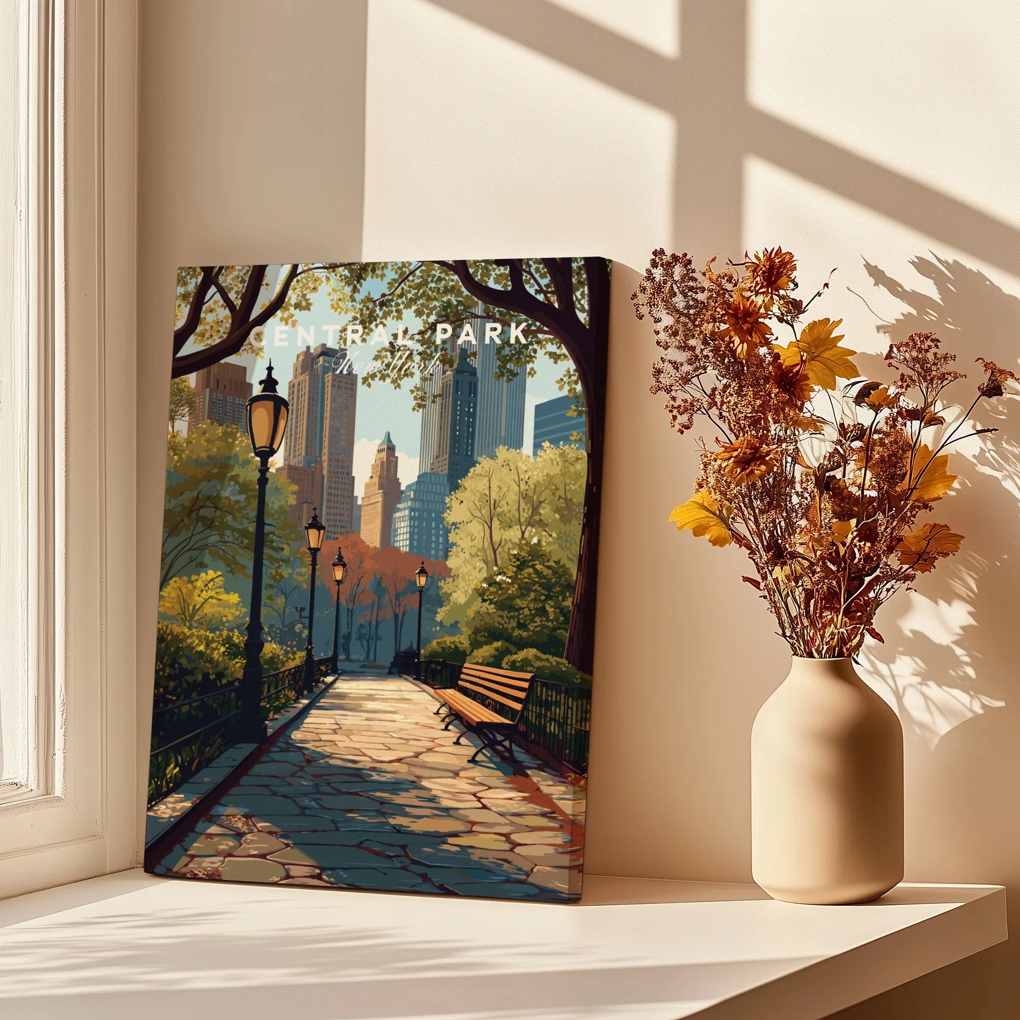 Central Park canvas art print with city skyline, on sunlit windowsill next to dried flowers