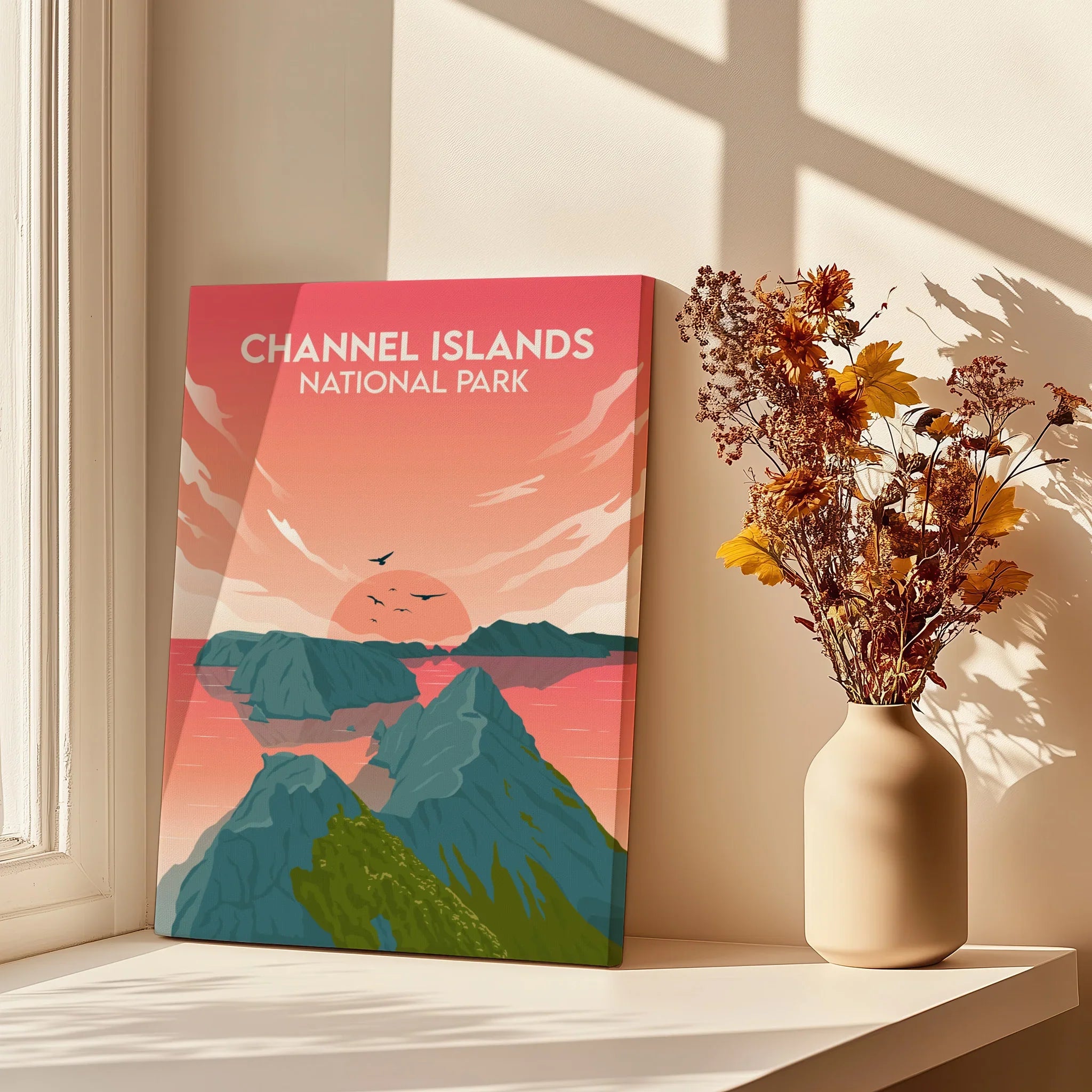 Channel Islands National Park print with sunset and ocean scenery on windowsill, vase of flowers nearby