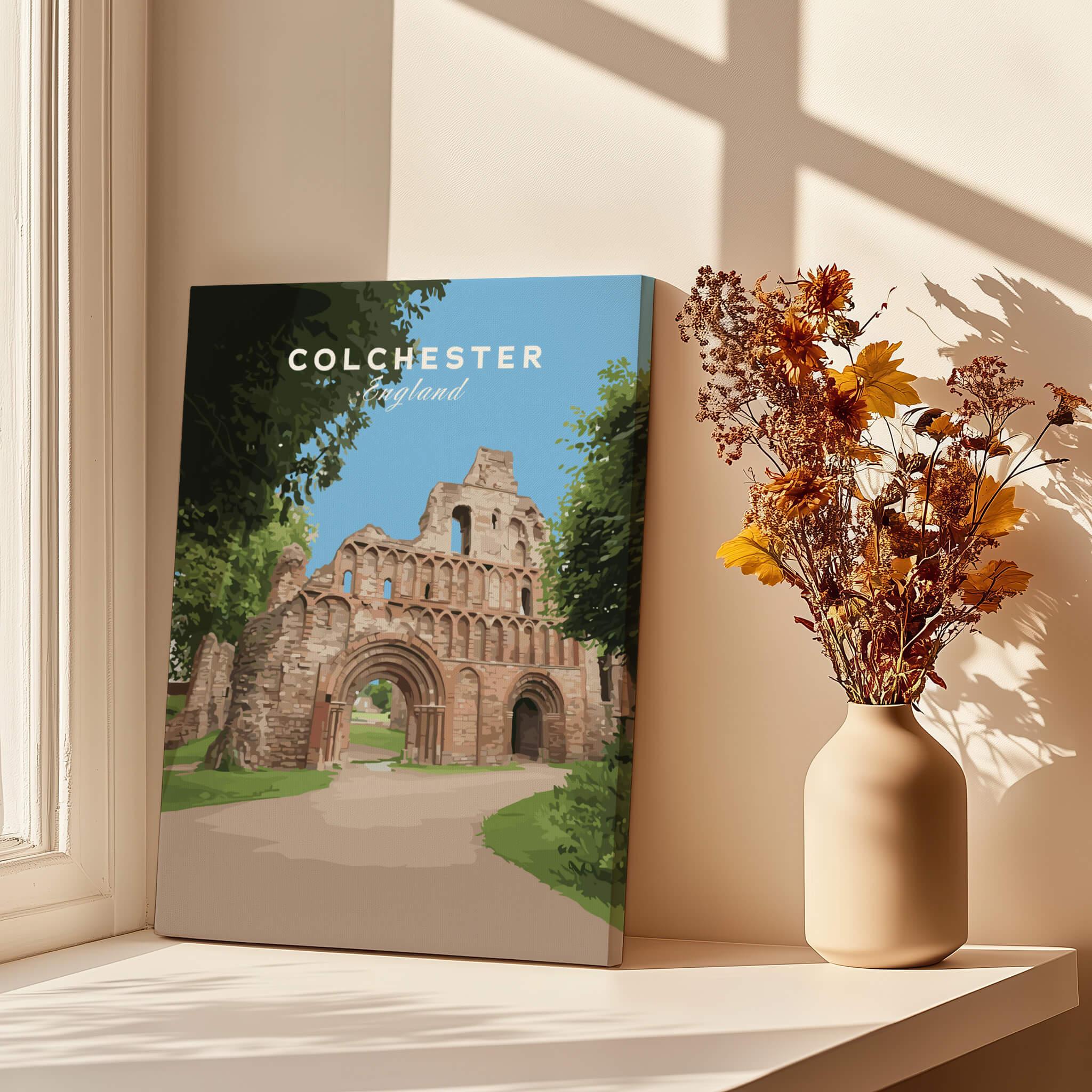 Colchester England travel poster print on windowsill with sunlight and vase of dried flowers