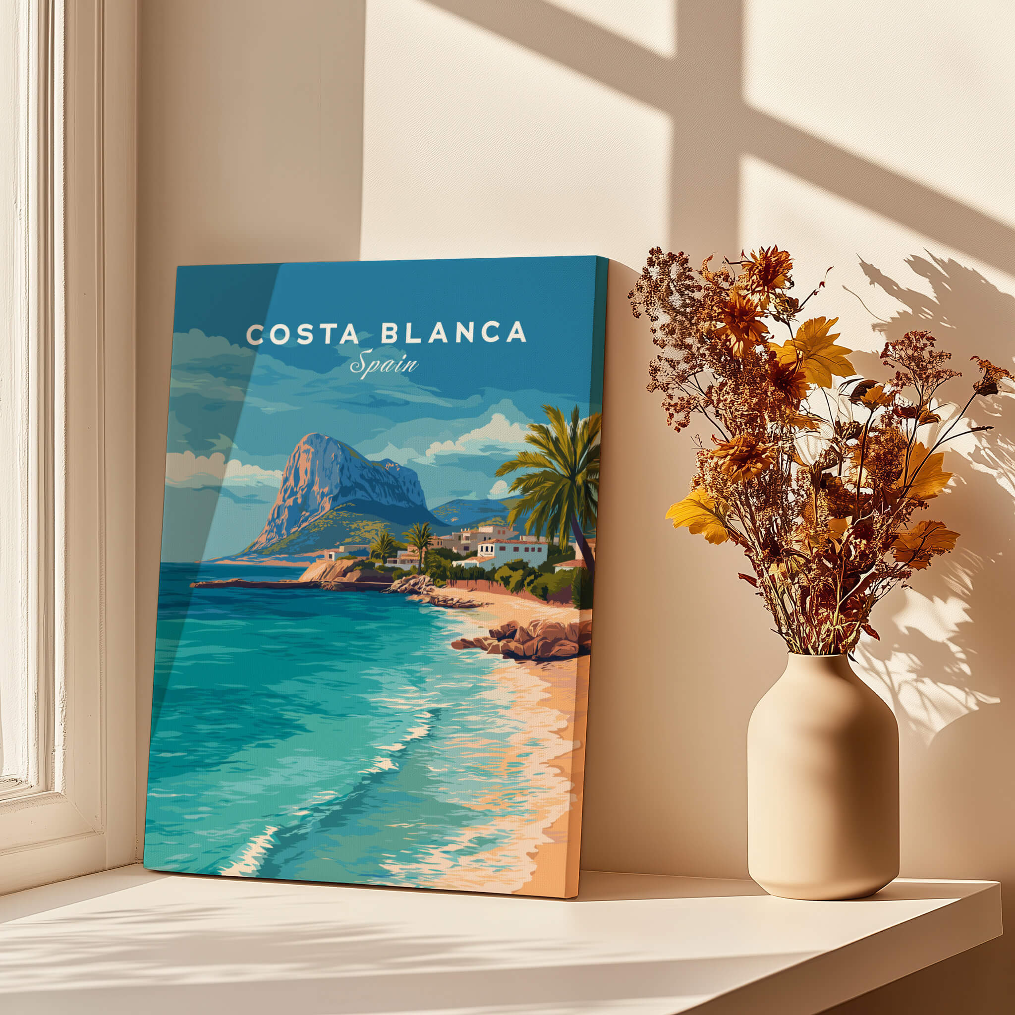 Costa Blanca Spain Travel Art – Mediterranean Village & Turquoise Sea Landscape Poster displayed near flowers.