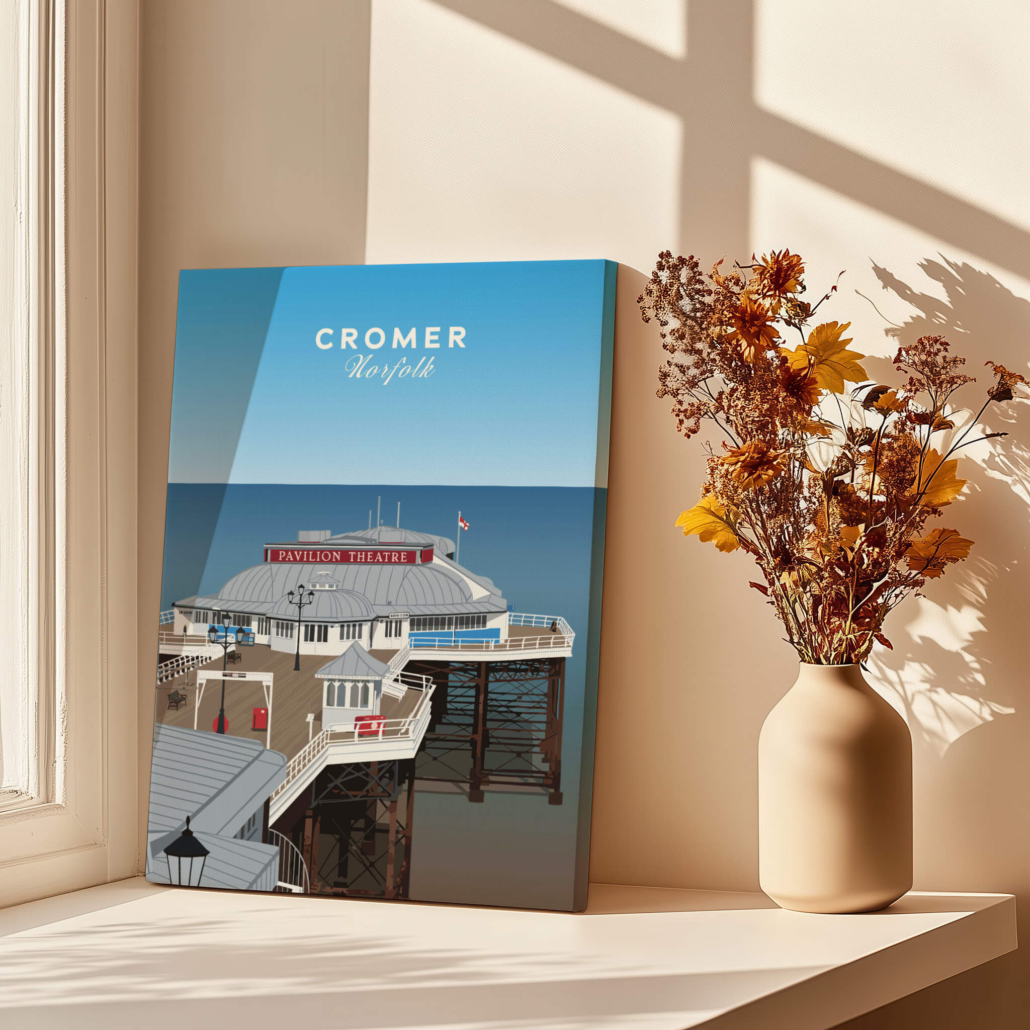 Cromer Travel Poster – Norfolk Pier & Pavilion Theatre Landmark Art displayed next to a vase with flowers.