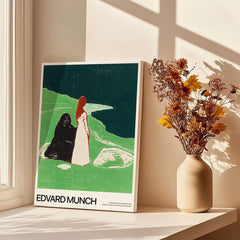 Edvard Munch Art Print - Two Women on the Shore 1898 Woodcut AIC Poster displayed on a table with vase of flowers.