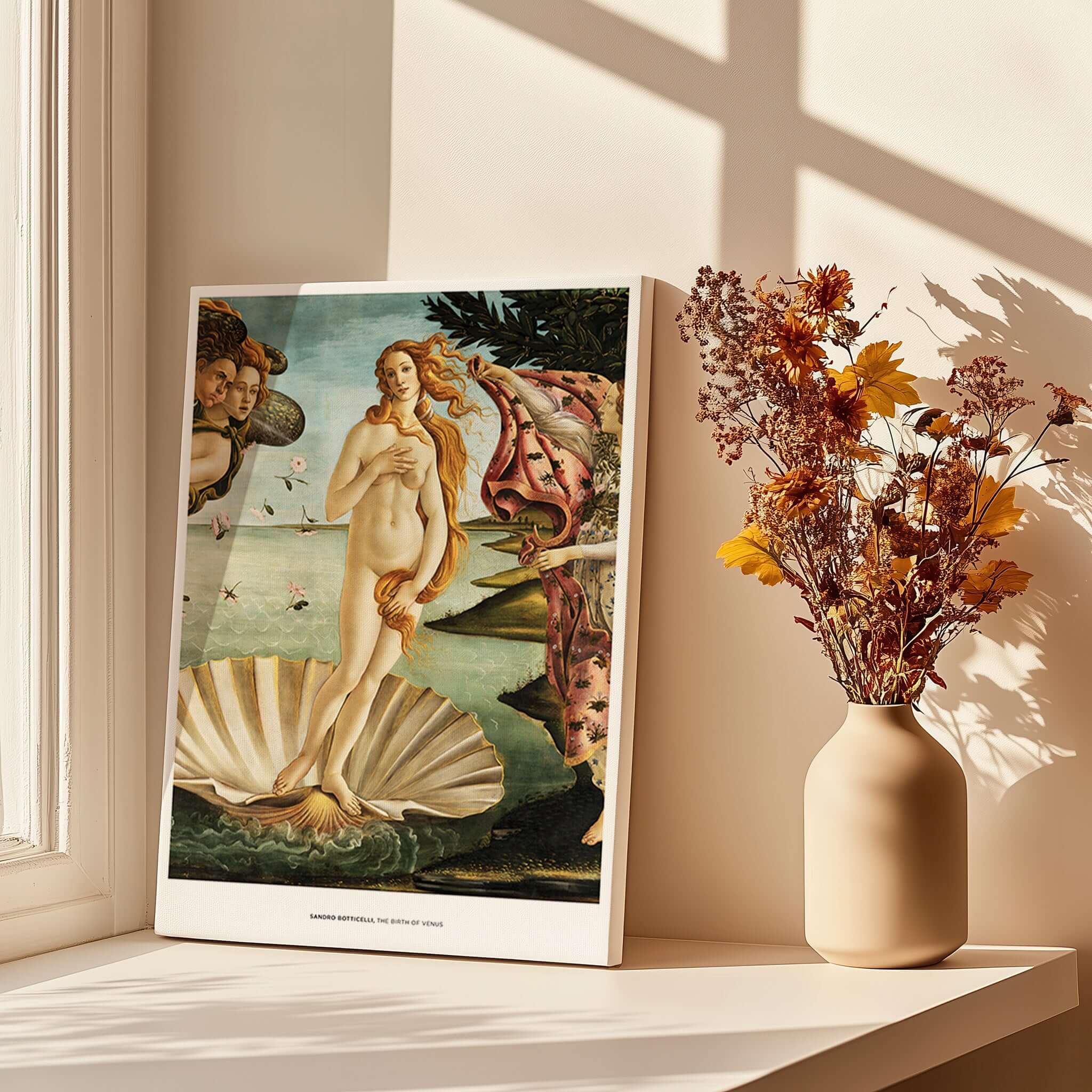 The Birth of Venus Art Print Sandro Botticelli Mythology Poster displayed on a table near flowers and sunlight.
