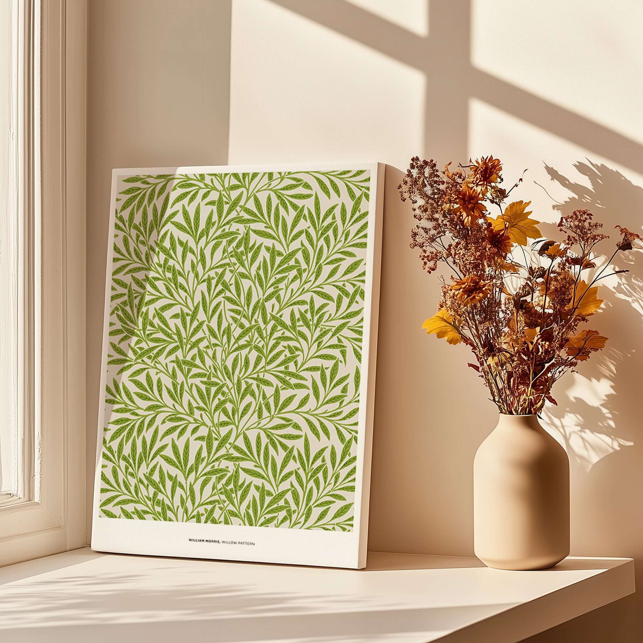 Exhibition Art Print William Morris Willow Pattern Green Botanical Wall Art displayed near a vase of flowers.