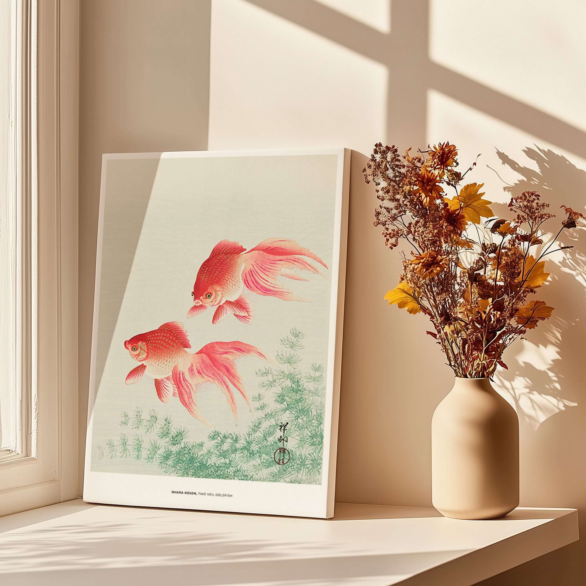 Exhibition Art Print Ohara Koson Two Veil Goldfish Japanese Fish Poster displayed near natural sunlight and a vase of dried flowers.