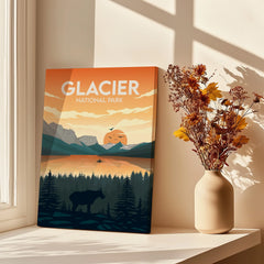 Glacier National Park canvas art print with sunset and mountains, next to a vase of dried flowers on a sunlit windowsill.