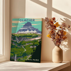 Glacier National Park travel poster print on windowsill with vase of autumn flowers