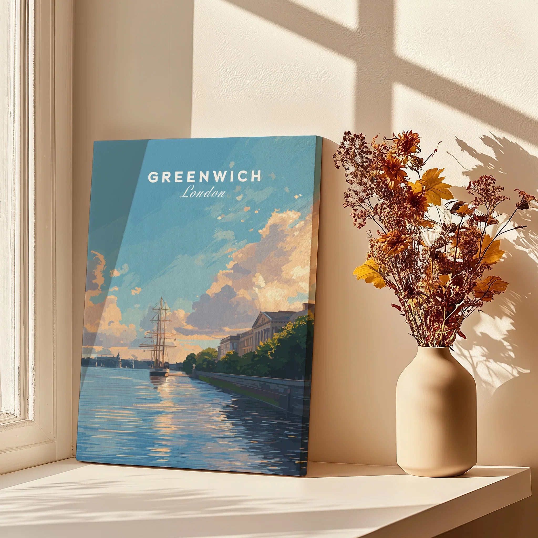 Greenwich London travel poster canvas print on windowsill with vase of dried flowers, sunlight and shadows.