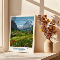 Grindelwald Switzerland Posters | Lush Green Mountain Valley Canvas Print displayed near a vase with dried flowers on a windowsill.