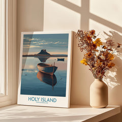 Holy Island Poster Northumberland | Lindisfarne Canvas Print featuring serene waters and a boat in the foreground.