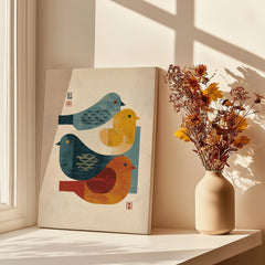 Modern canvas print with abstract birds by a window, next to a vase of dried flowers