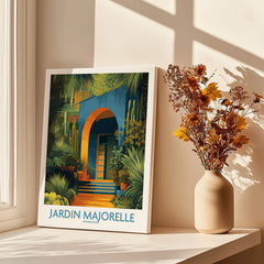Jardim Majorelle Marrakesh Posters | Canvas Print displayed near a vase of flowers in a sunlit room.