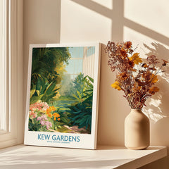 Kew Gardens art print with tropical plants, beside a vase of dried flowers on a sunlit shelf